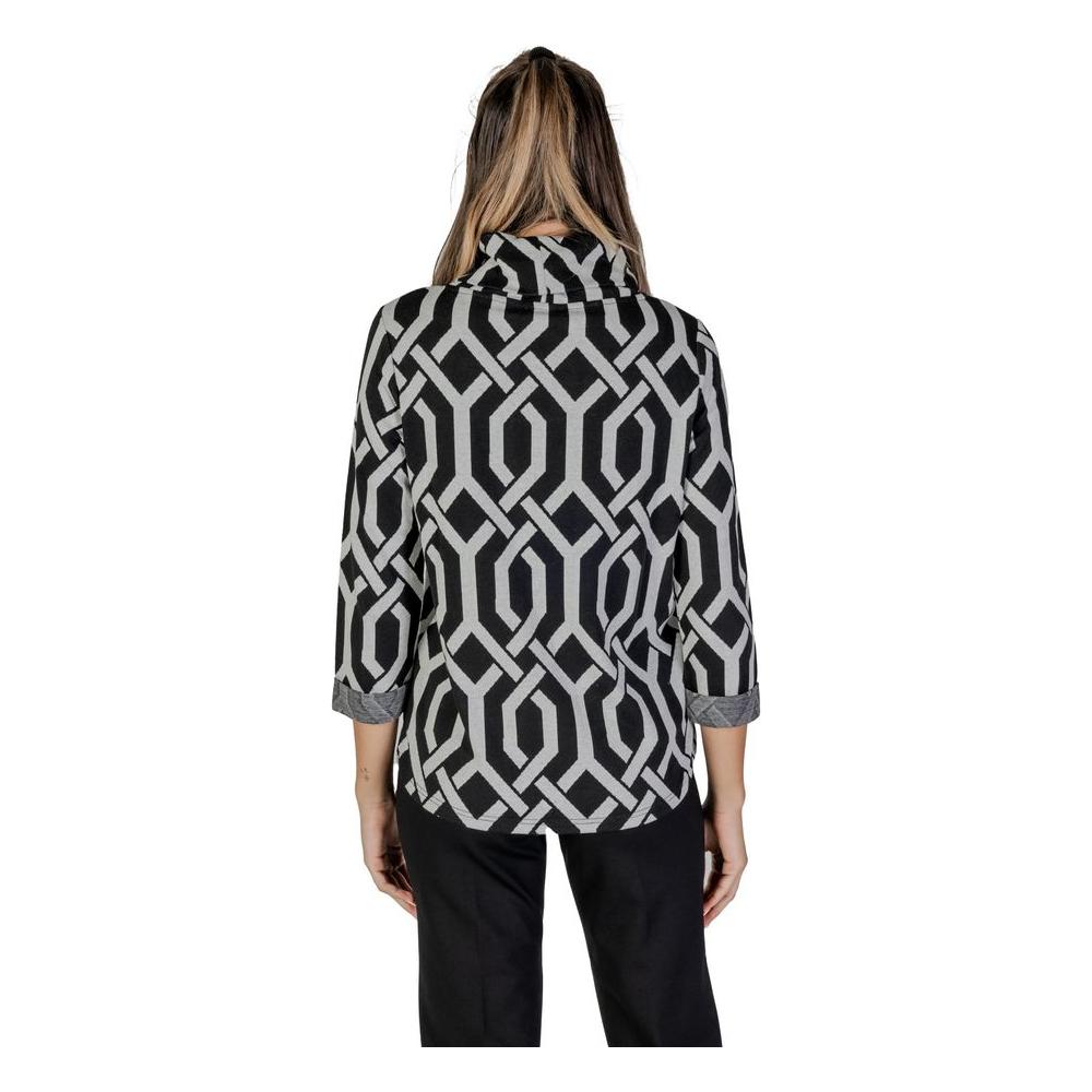 Back view of a woman wearing a black geometric patterned sweater from Street One's Fall/Winter women's knitwear collection.