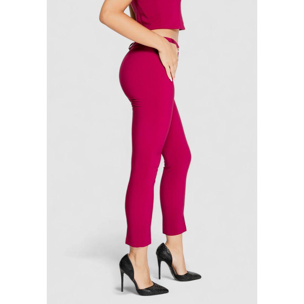 Side view of a woman wearing Rinascimento Bordeaux polyester pants, fall/winter collection, showcasing slim fit and elegant design.