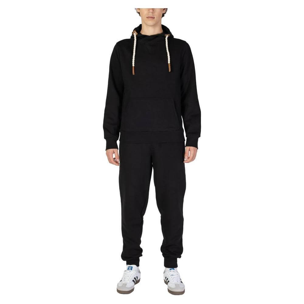 Model wearing Hydra Clothing black cotton sweater, men's fall/winter collection, made with 60% cotton and 40% polyester.