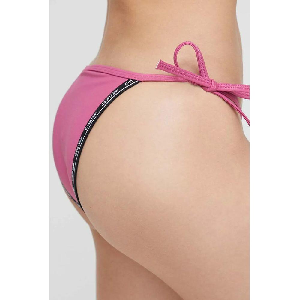 Calvin Klein Jeans Pink Polyester SwimwearDiscover the String Side Tie bikini bottom for women by Calvin Klein Jeans, an essential piece for your summer wardrobe. Made from 78% polyamide and 22% elastane, this bottom offers a great fit and comfort, perfec