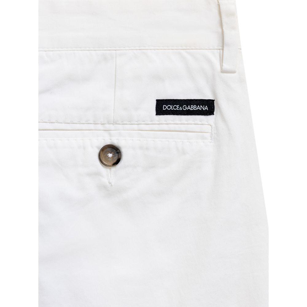 Dolce & Gabbana white cotton Bermuda shorts with back pocket, button closure, and contrasting logo tag. Regular fit, 97% cotton.