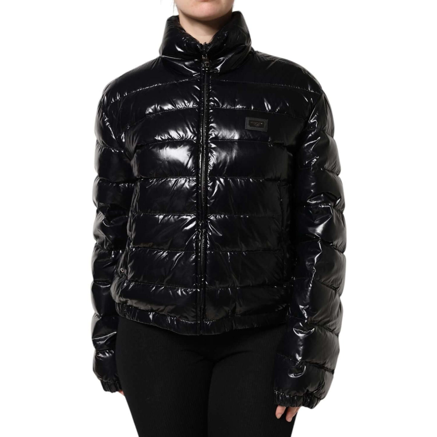 Dolce & Gabbana black full zip puffer jacket with logo plaque, long sleeves, high-quality Italian craftsmanship, made of nylon and polyurethane.