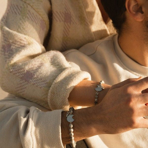 Couple wearing AN JEWELS JEWELRY Mod. ADC.BWGLB02S bracelets, showcasing elegant design and craftsmanship.