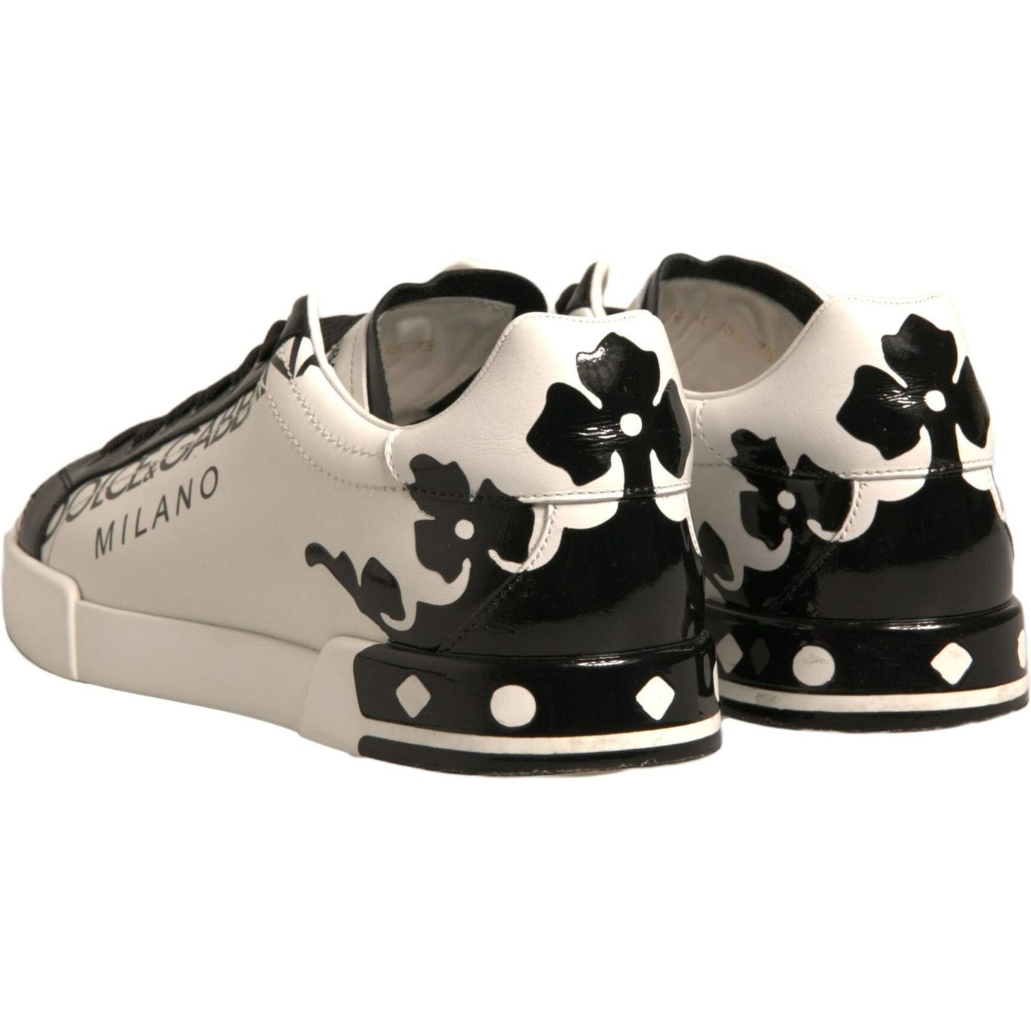 Dolce & Gabbana Milano low-top sneakers in white and black leather with crown details and rubber sole.
