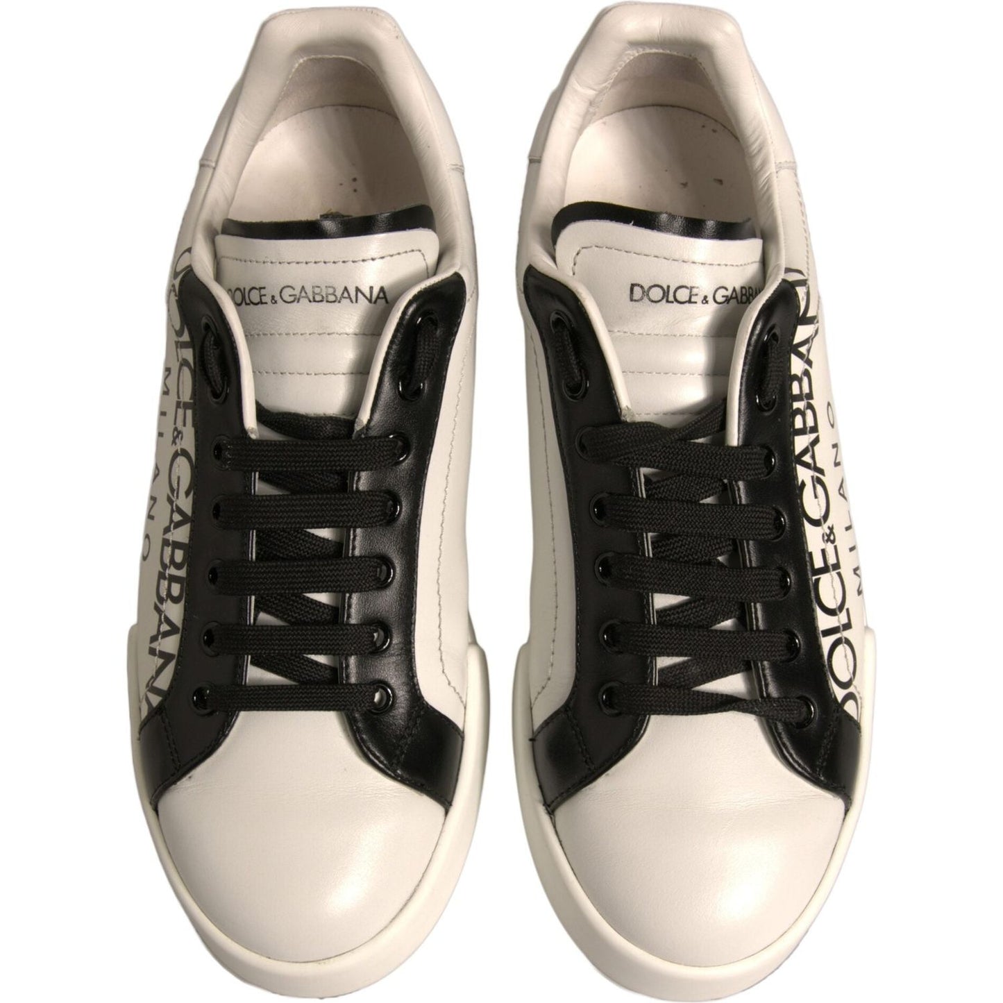 Dolce & Gabbana white and black leather low-top sneakers with logo details and lace-up closure.