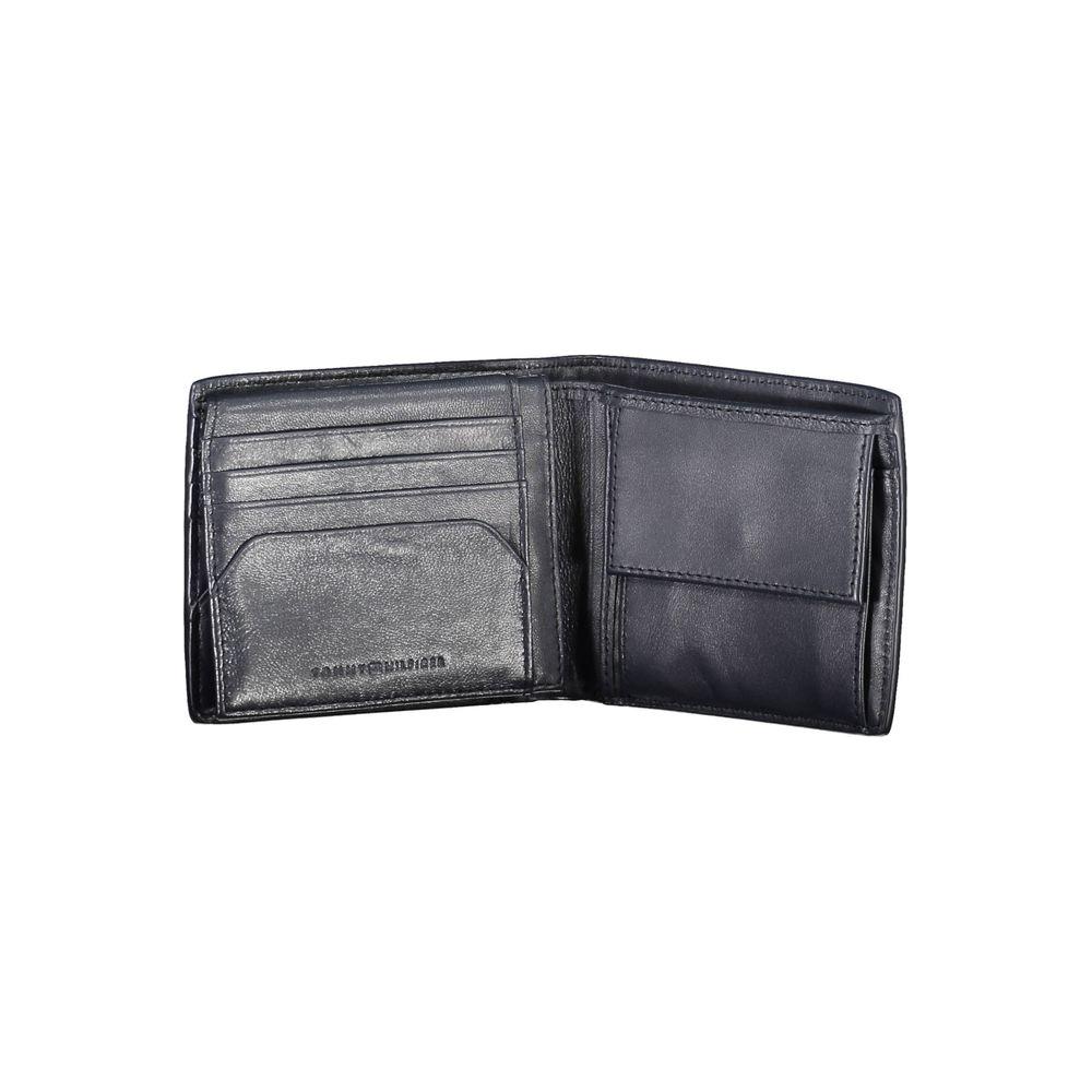 Interior view of a blue leather Tommy Hilfiger men's wallet with card slots and a coin purse.
