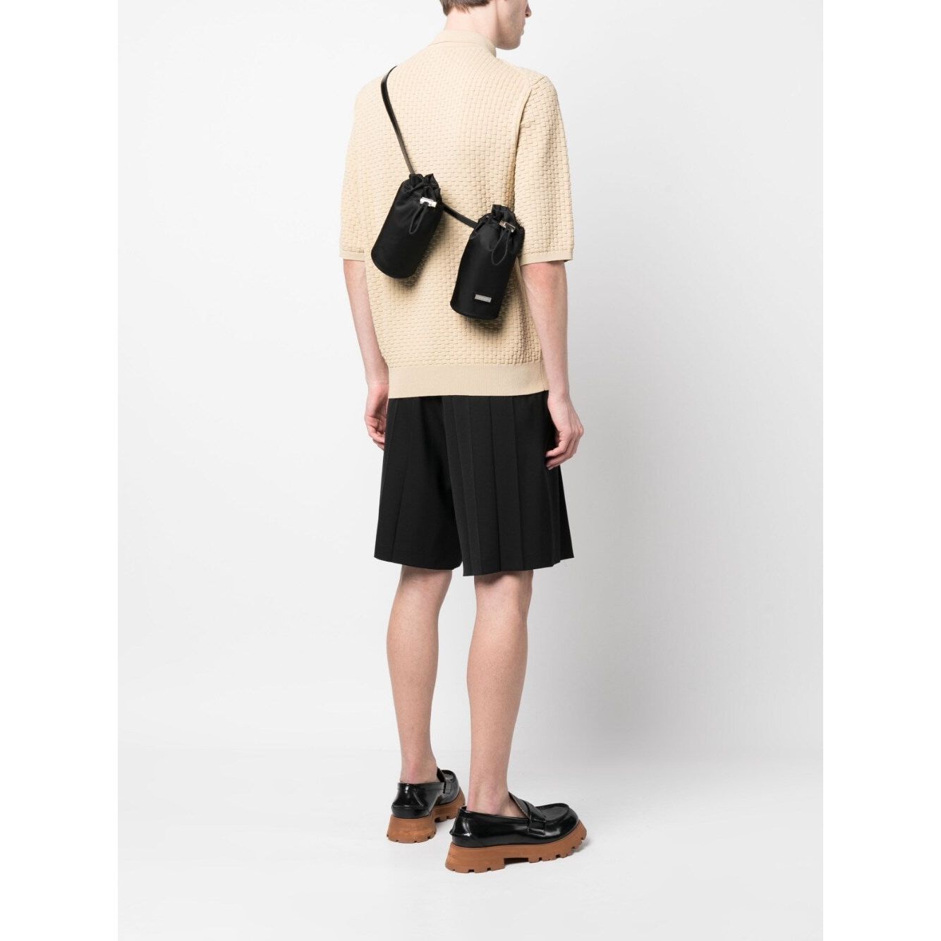 Front view with bag zipped and handles upright.