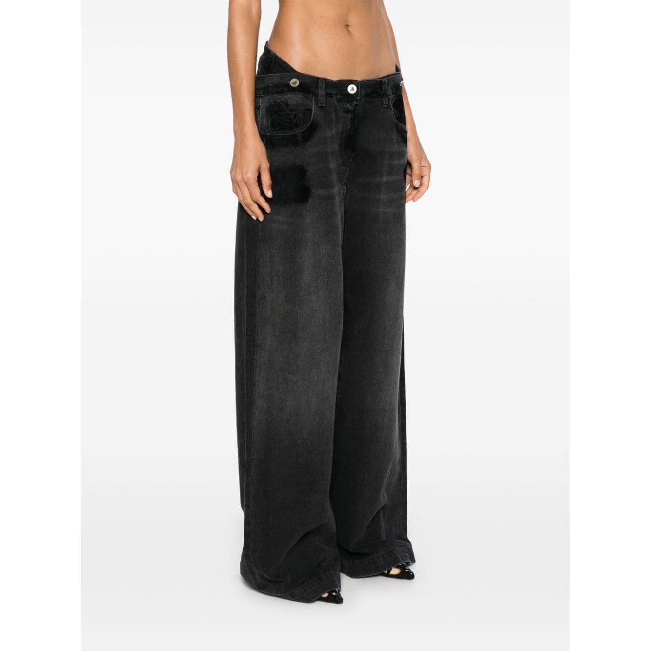 بنطلون جينز أتيكو المصنوع من قماش الدنيم القطني الأسود والممزق