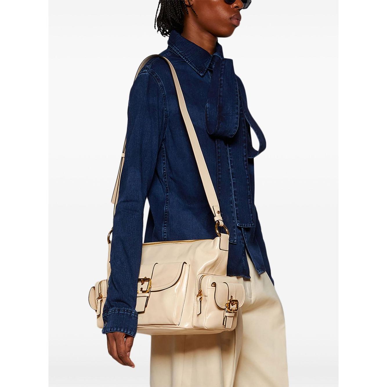 Front view with bag zipped and handles upright.