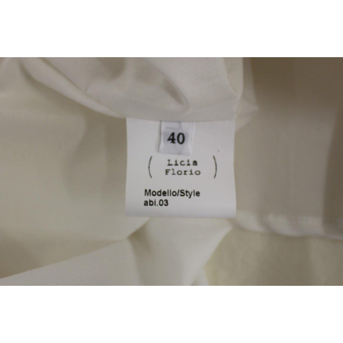 فستان أنيق من Licia Florio باللون الأبيض مع رقبة على شكل حرف V