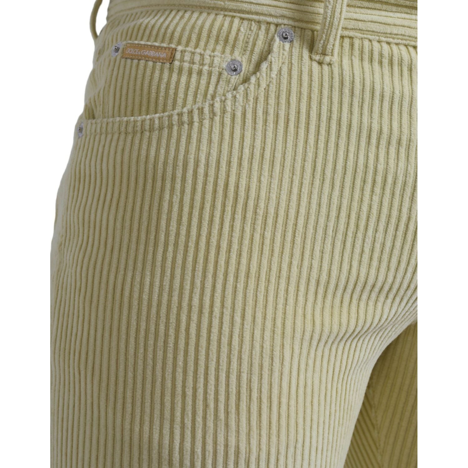 بنطلون جينز ضيق من قماش مخملي أصفر اللون مزين بشعار دولتشي آند غابانا