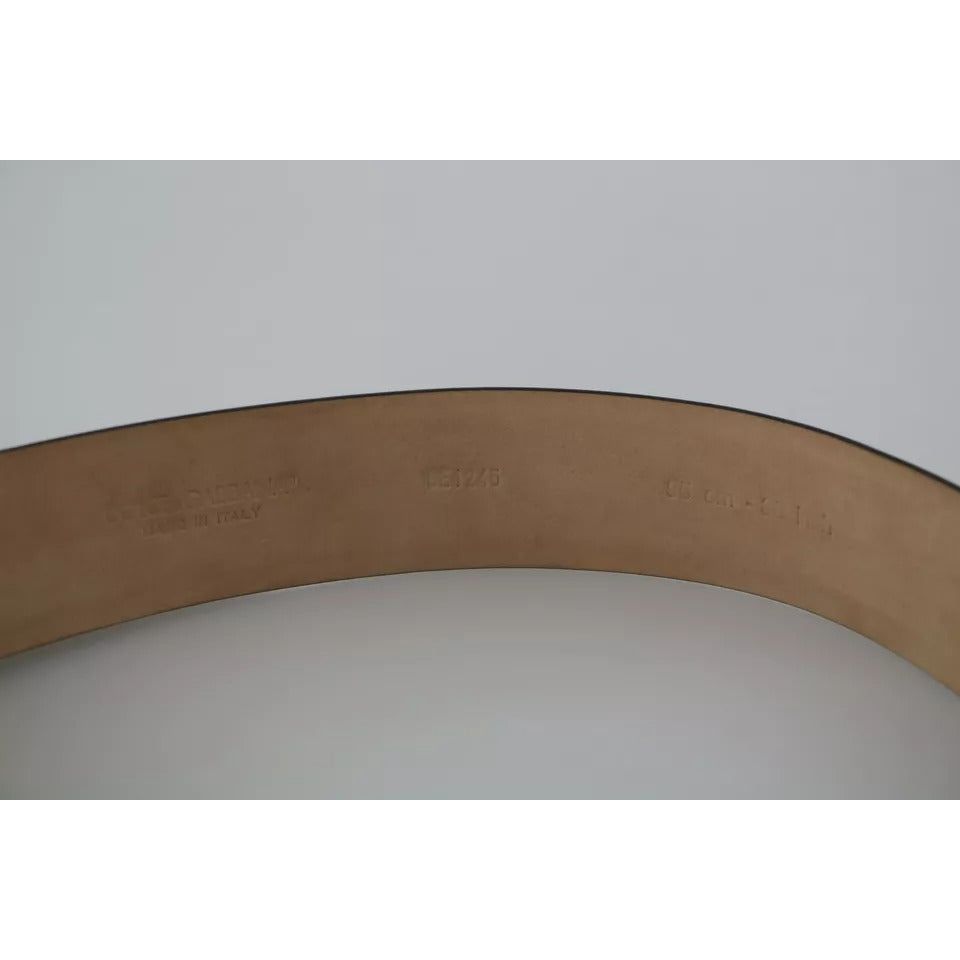 حزام دولتشي آند غابانا المصنوع من الجلد الأسود اللامع والمزين بشعار الكريستال