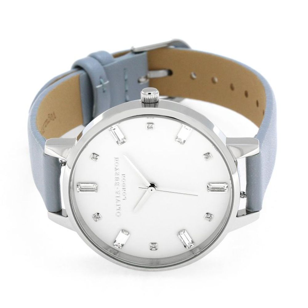 Olivia Burton Blue Artificial Leather Dress Watch with silver stainless steel case and white dial, featuring quartz analog mechanism.