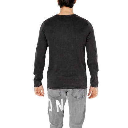Man wearing Jack Jones Black Cotton Sweatshirt, showcasing back view, crew neck, long sleeves, fine knit texture, casual style outfit