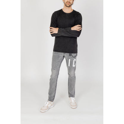 Man wearing Jack Jones Black Cotton Sweatshirt with grey jeans, showcasing a casual yet refined look.
