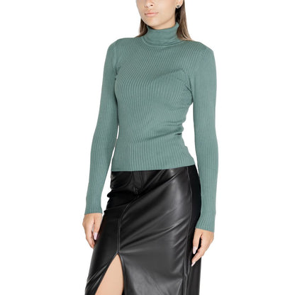 Woman wearing Jacqueline De Yong Turquoise Viscose Sweatshirt with roll neck and long sleeves, styled with a black leather skirt.