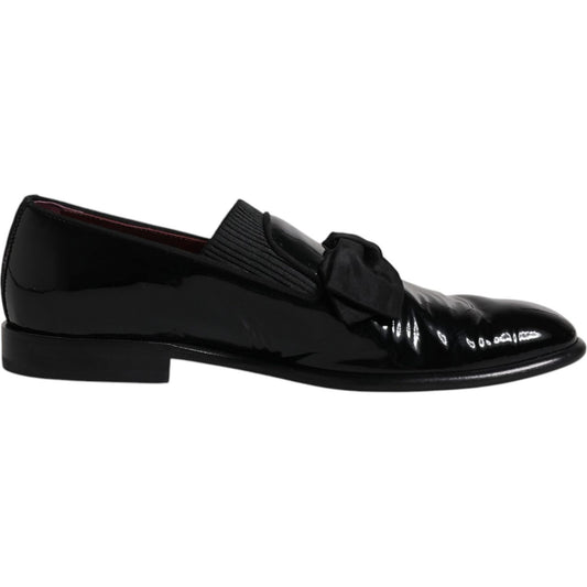 Dolce & Gabbana black leather loafers for men, formal dress shoes with logo detail, made in Italy, slightly preowned, elegant design.