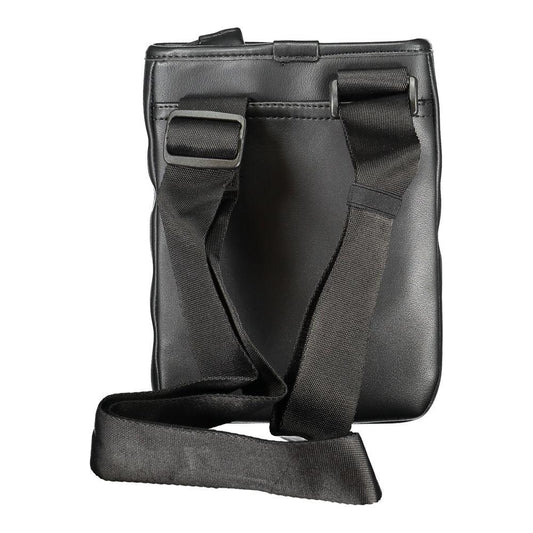 Tommy Hilfiger black polyethylene shoulder bag with adjustable strap and external pocket, featuring zip closure and logo print.
