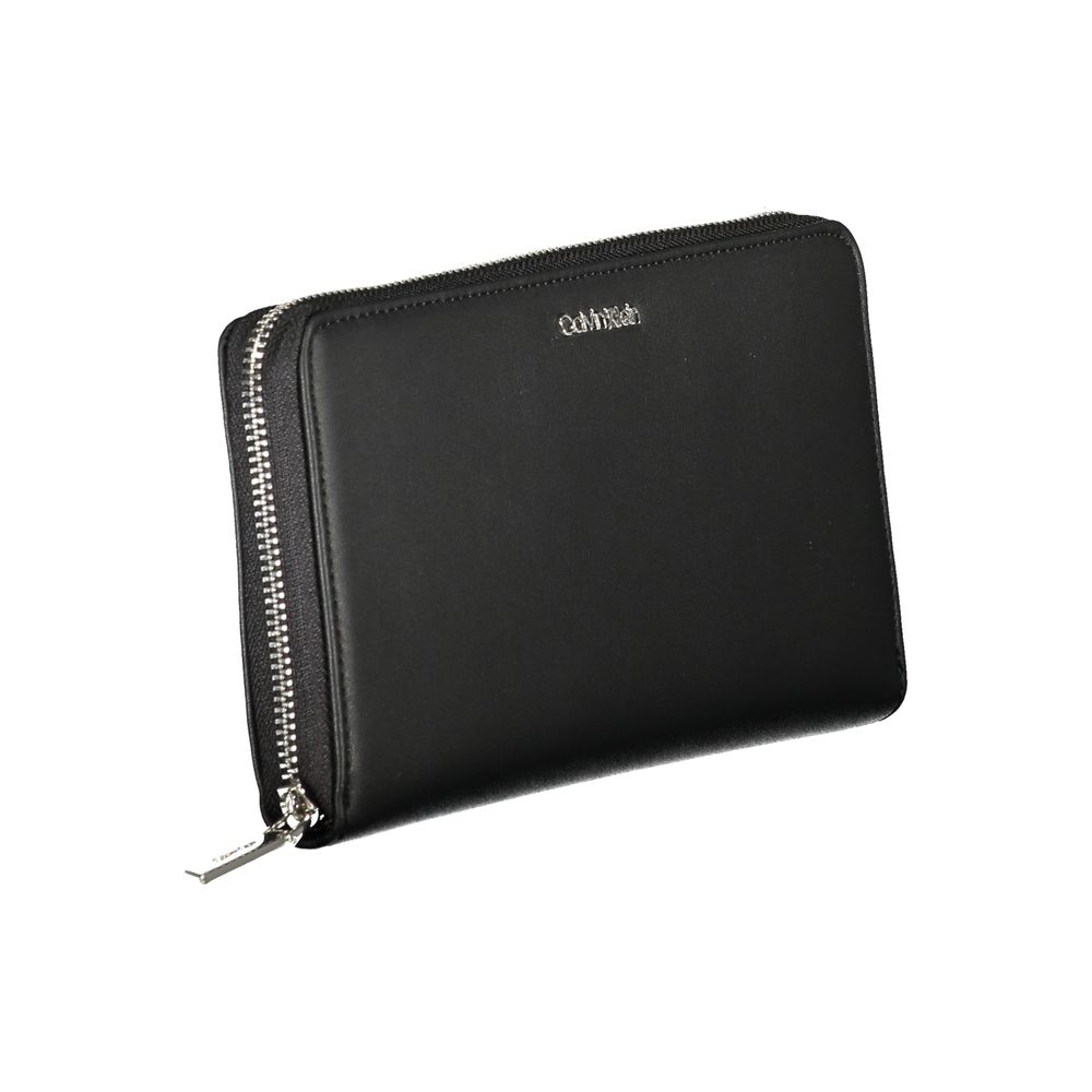 Calvin Klein Black Polyester Wallet with zip closure, RFID blocking, coin purse, and 3 compartments; made of 50% recycled polyester.