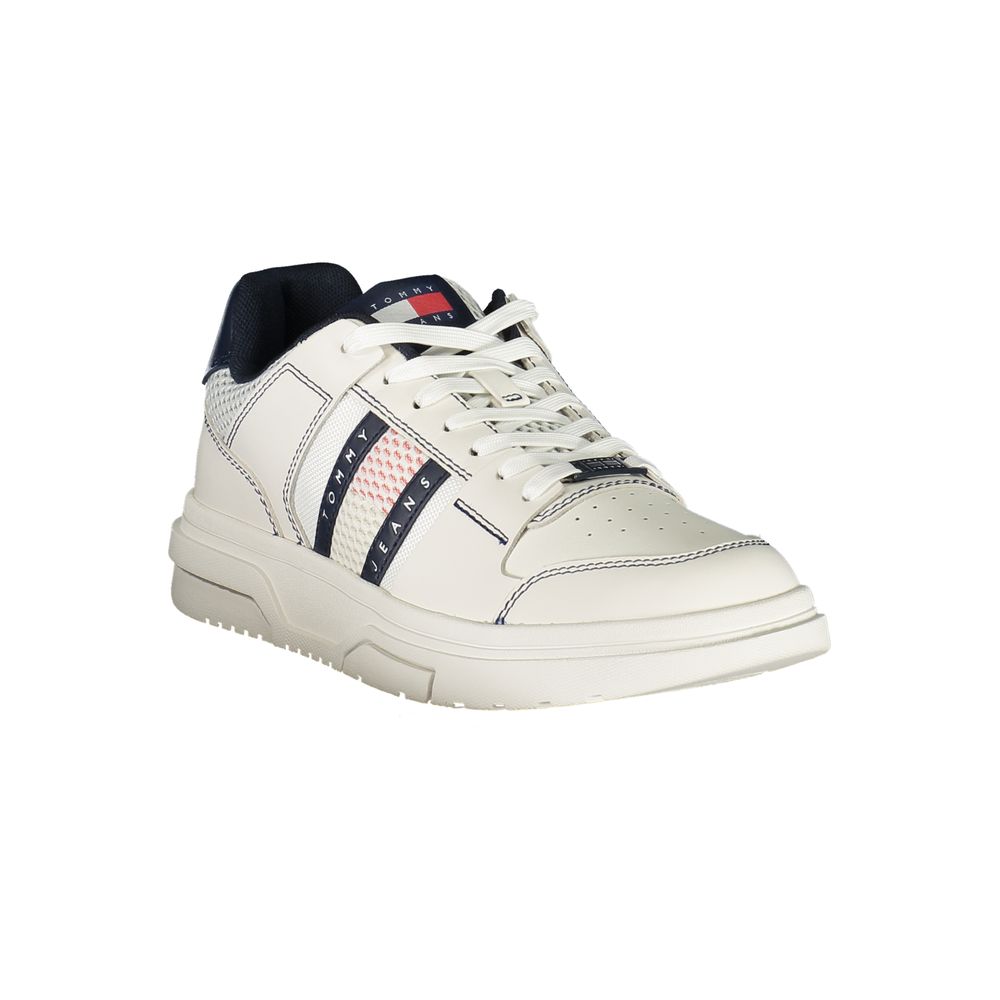 White and navy men's sneaker with Tommy Hilfiger branding and striped detail, showcasing classic and modern style.