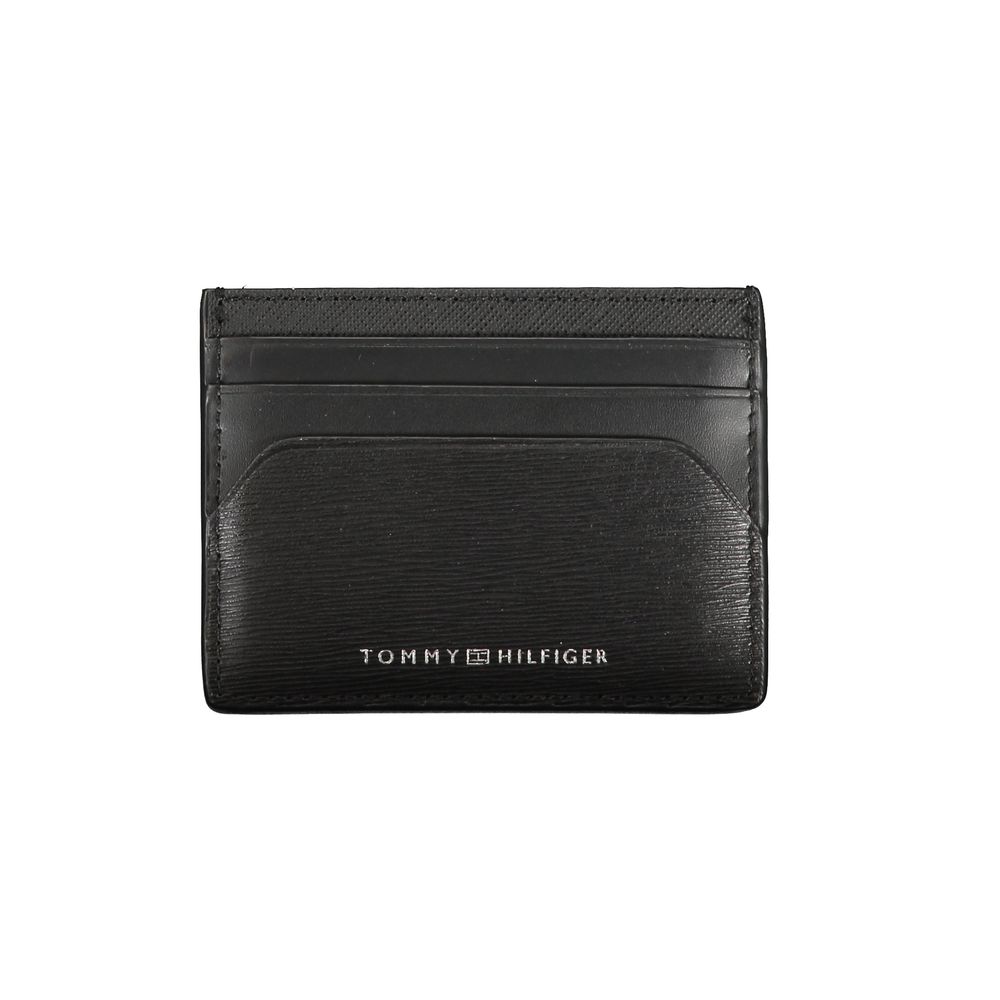 Tommy Hilfiger Black Leather Wallet with card holder, central pocket, and logo print. Stylish and functional accessory for daily use.