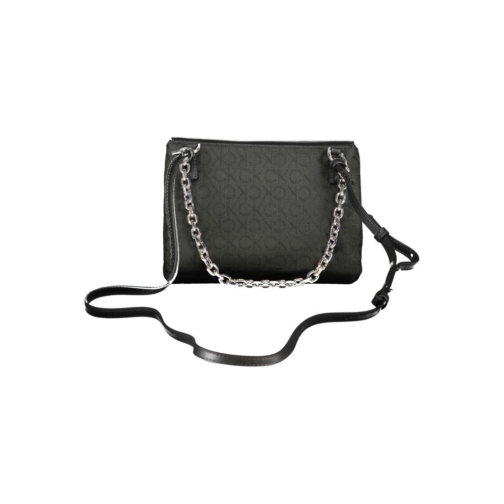 Calvin Klein Black Polyester Handbag with chain handle, adjustable strap, logo, and turn closure. Features compartments and card pocket.