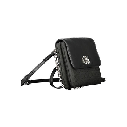 Calvin Klein Black Polyester Handbag with chain handle and adjustable strap, featuring logo and contrast details.