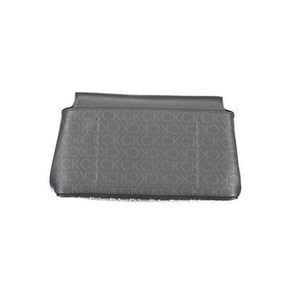 Calvin Klein Black Polyester Handbag with adjustable strap, internal pocket, snap closure, and logo details.