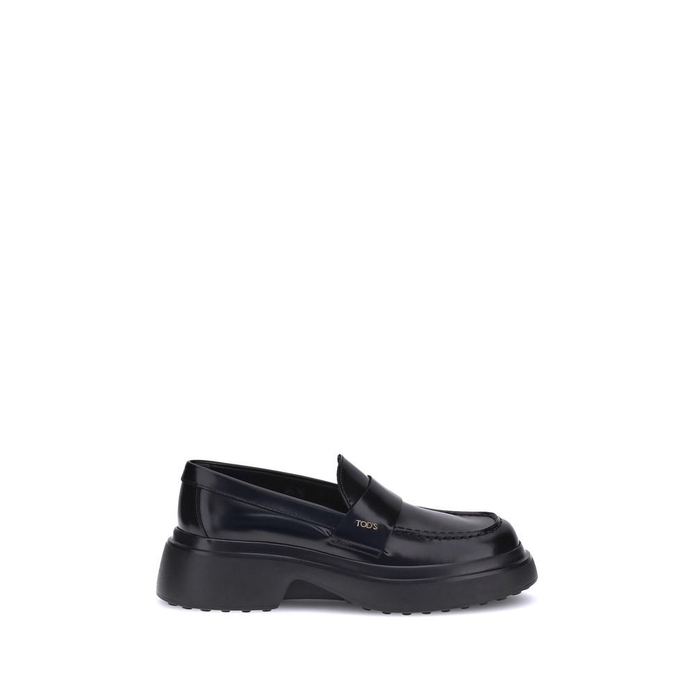 Tod's Black Rubber Platform Loafers with rounded toe and logo plaque.