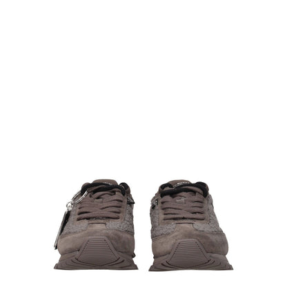 Marc Jacobs Gray Fur Chunky Sneakers with side detail, front and back logos, lace-up closure, round toe, low flat heel, and rubber sole.