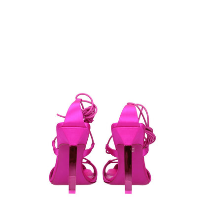 The Attico Pink Satin Stiletto Heel Sandals with high heels and self-tie closures, featuring a fuchsia satin design and open toe.