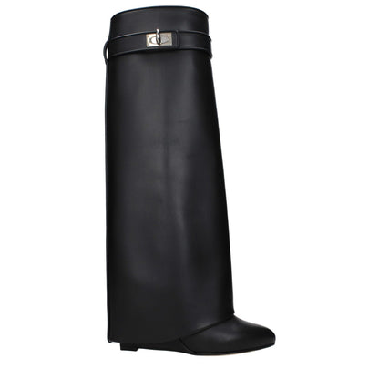 Givenchy Black Leather Boots with pointy toe, wedge heel, and side logo, featuring closure with turn lock and leather sole.