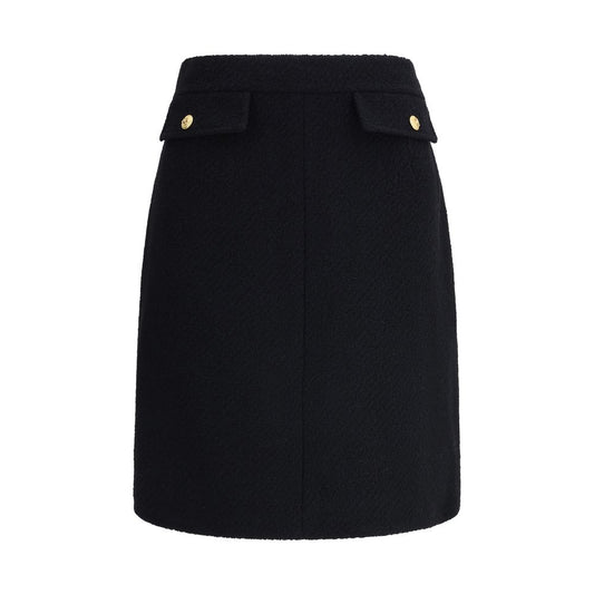 Chloé Black Wool Midi Skirt with front flap pockets and gold-tone buttons, designed for AW25 season.