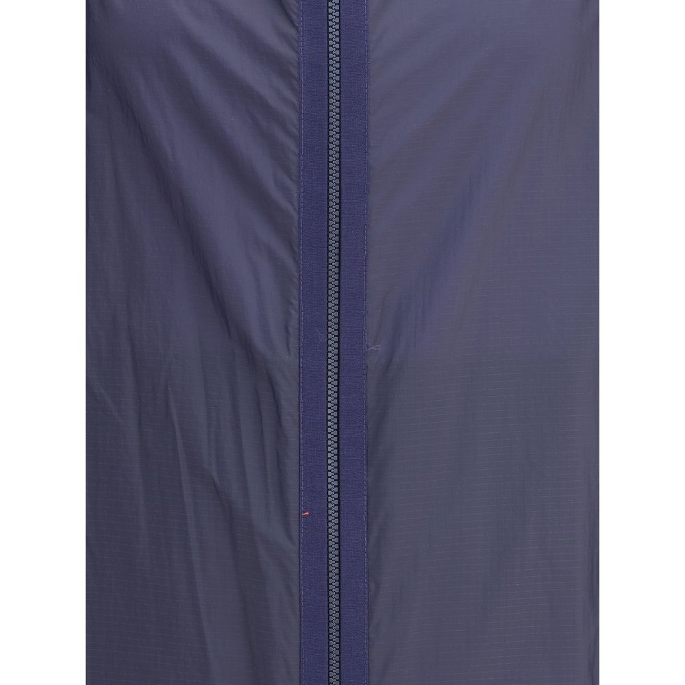 Close-up of Moncler x Donald Glover Blue Nylon Shell Jacket with waterproof ripstop fabric and zipper detail.