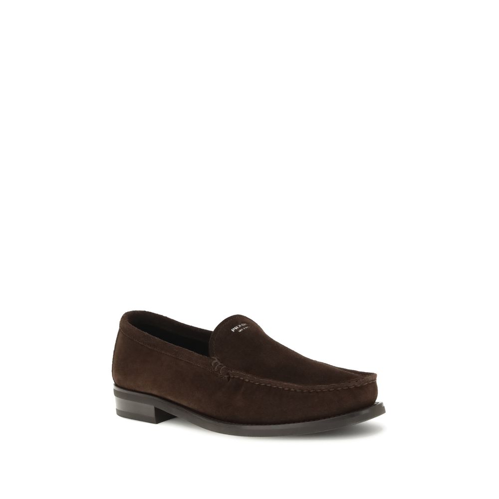 Prada Brown Calf Leather Bos Taurus Slip-On Loafers with suede finish and rubber sole ensuring comfort and elegance, AW25 collection.