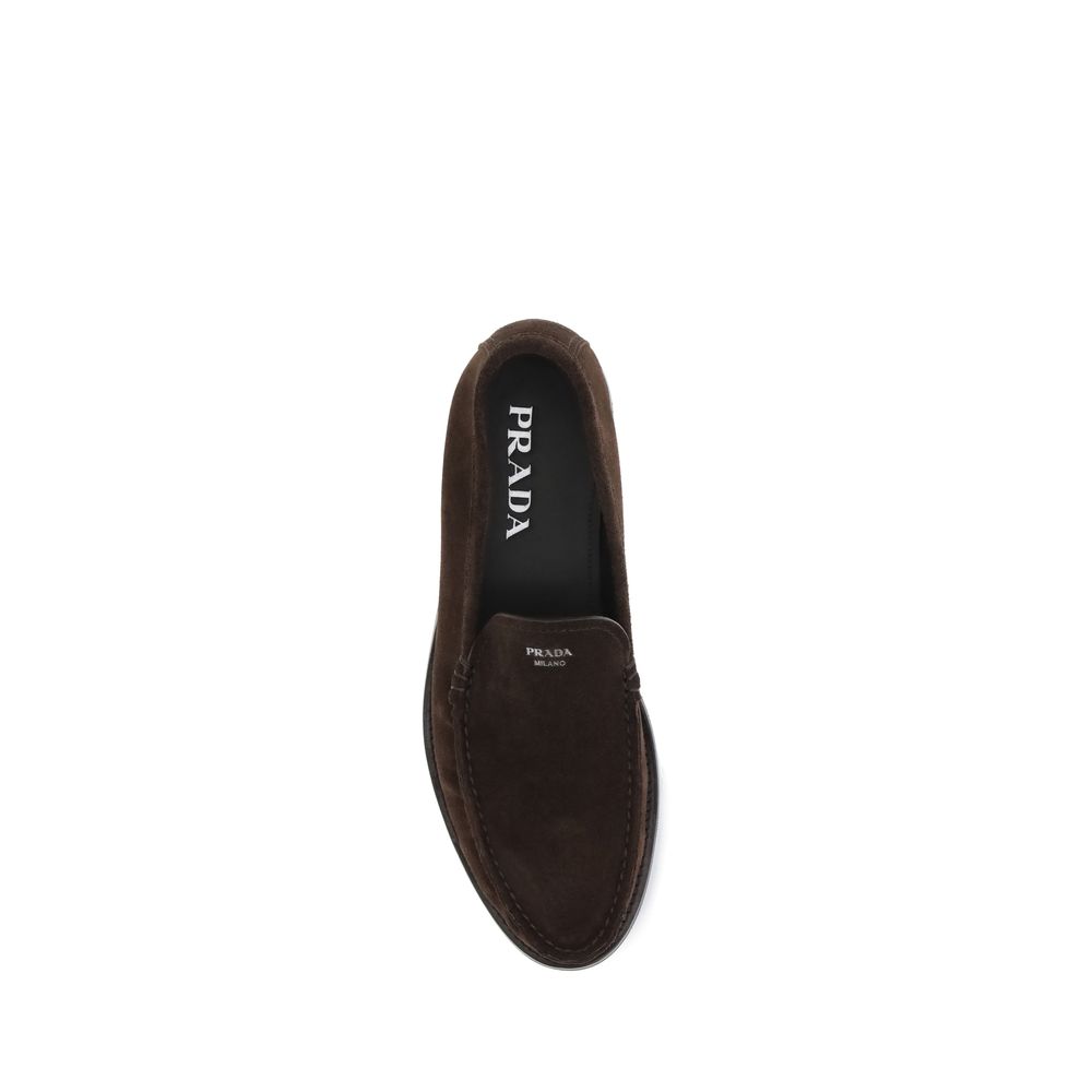 Prada Brown Calf Leather Bos Taurus Slip-On Loafers with suede finish and screen-printed logo, top view of elegant footwear.