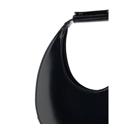 Close-up view of Staud Black Calf Leather Bos Taurus Shoulder Bag with iconic moon shape and rigid handle.