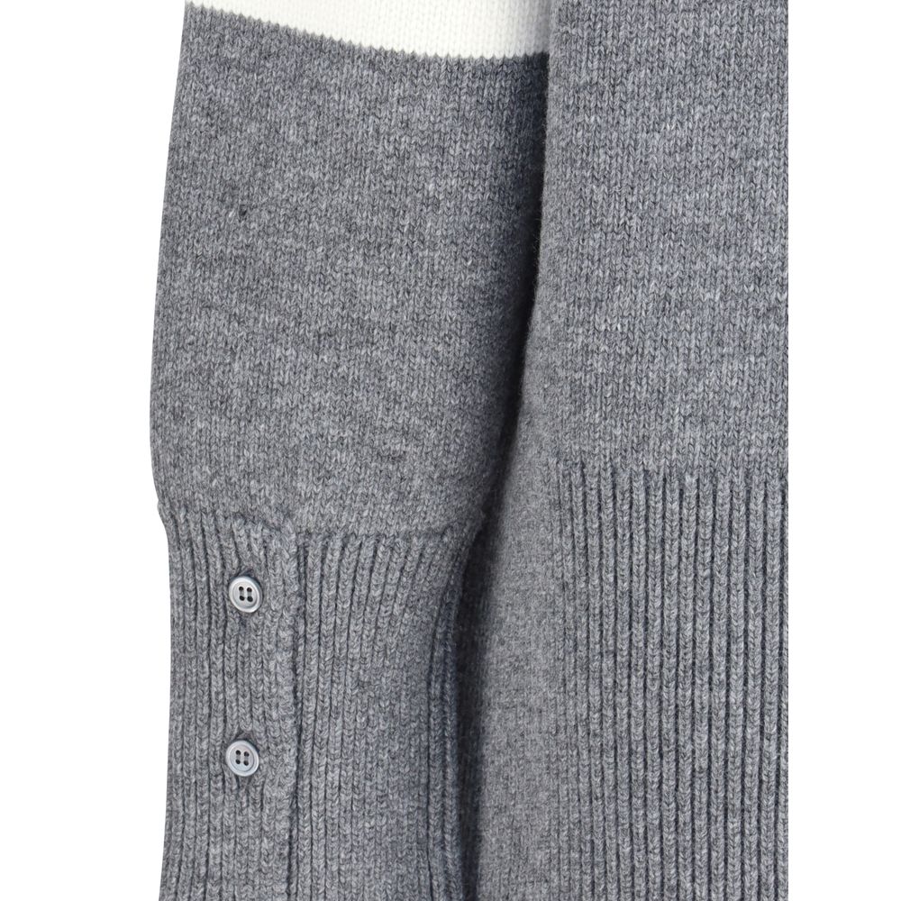 Detail of Thom Browne Gray Fleece Wool Sweatshirt showing ribbed cuffs and side buttons.