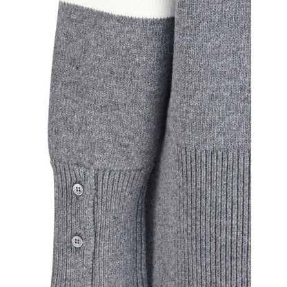 Detail of Thom Browne Gray Fleece Wool Sweatshirt showing ribbed cuffs and side buttons.