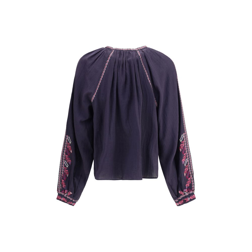 Back view of Marant Etoile Blue Cotton Blouse with raglan sleeves and cross-stitch embroidery for a boho-chic look.