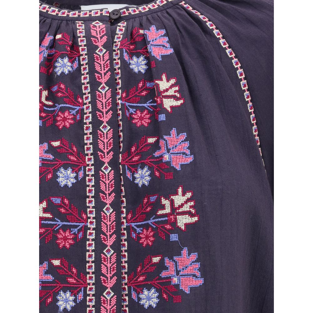 Embroidered detail of Marant Etoile Blue Cotton Blouse with cross-stitch patterns and concealed buttons for a boho-chic look.