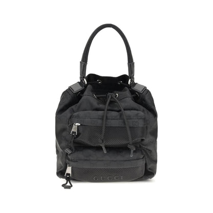 Gucci Black Polyamide Backet Bag with GG Supreme pattern, drawstring closure, and zippered pockets for functional organization, AW25 season.