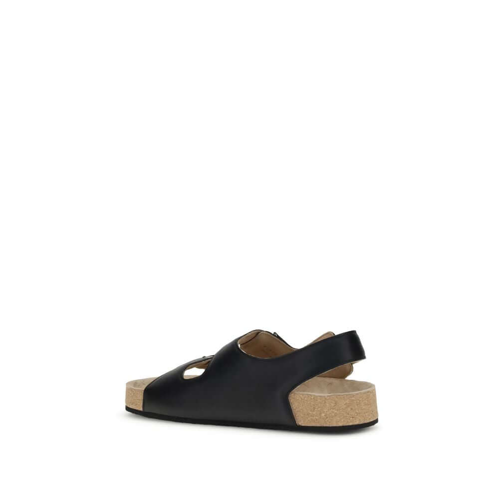 Balenciaga Black Calf Leather Bos Taurus Flat Sandals with cork-lined sole and ergonomic insole, rear view of luxury footwear.