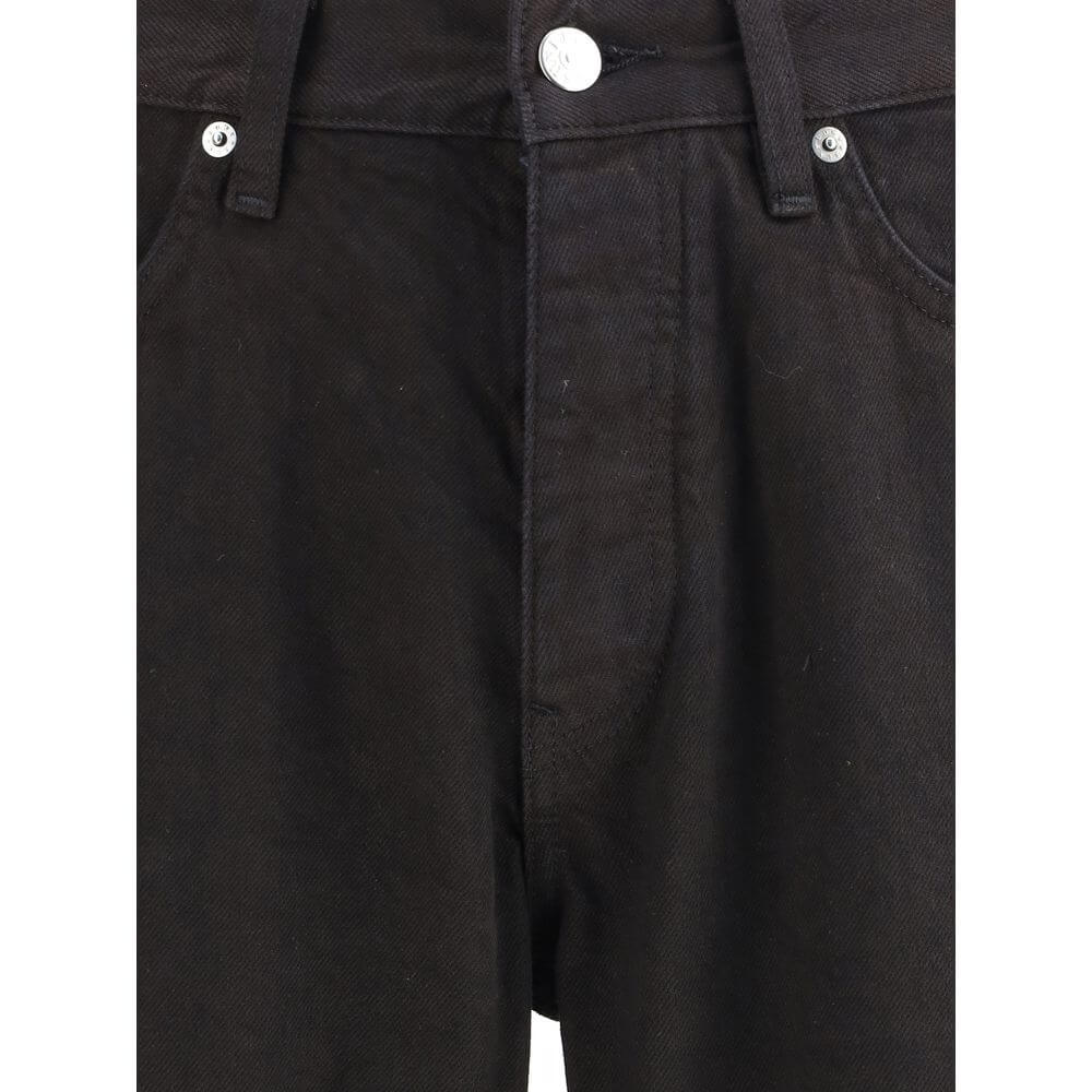 Close-up of Sunflower Black Cotton Relaxed Fit Jeans with button and zipper closure, featuring belt loops and sustainable design.