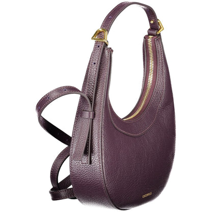 Coccinelle Purple Leather Women Handbag with adjustable strap and gold accents, showcasing premium craftsmanship.