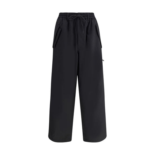 Y-3 Black Wool Casual Pants with elastic waistband and asymmetrical cuffs, showcasing urban style and functionality with multiple pockets.