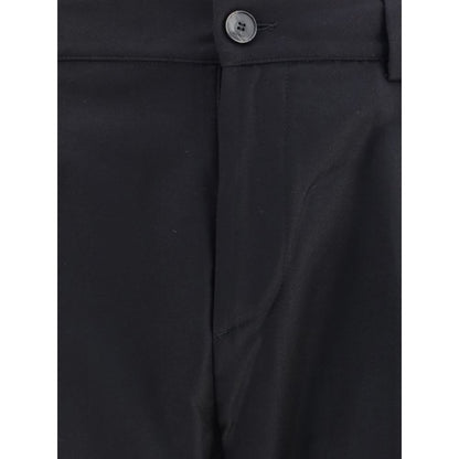 Close-up of Cruna Black Fleece Wool Dress Pants with buttoned waist and elegant style, perfect for casual yet polished look.