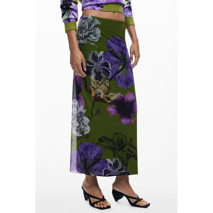Woman wearing a Desigual Green Polyester Women Skirt with purple floral design and elasticated waist, showcasing whimsical tulle flowers.