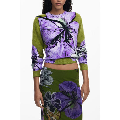 Woman wearing Desigual Green Polyester Women Skirt with floral detailing, paired with a matching vibrant top showcasing colorful motifs.