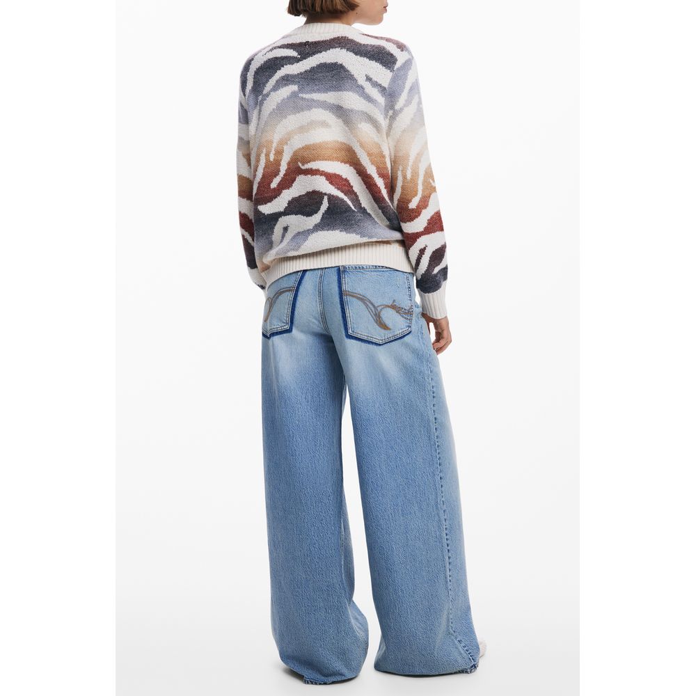 Model wearing Desigual White Polyamide Women Sweater with bold patterns and wide-leg jeans, showcasing trendy style and comfort.